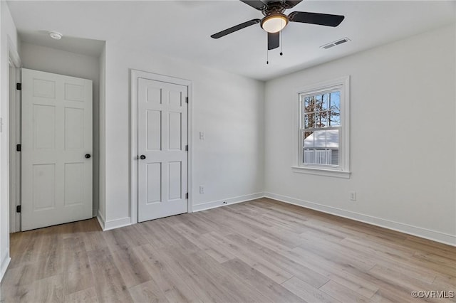 unfurnished bedroom featuring ceiling fan and light hardwood / wood-style flooring