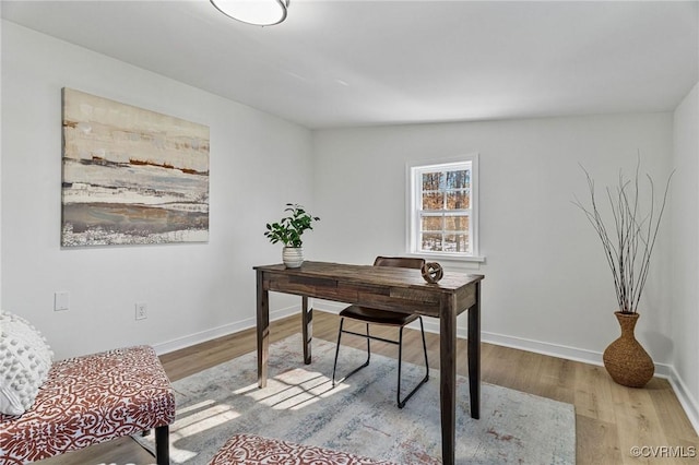 office area with lofted ceiling and light hardwood / wood-style flooring