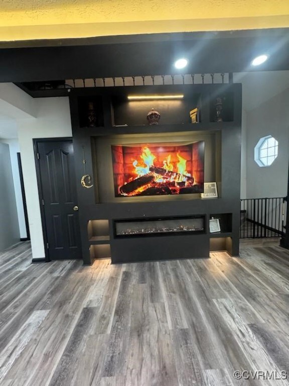 home theater room featuring wood-type flooring