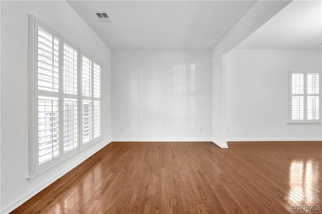 spare room with hardwood / wood-style flooring