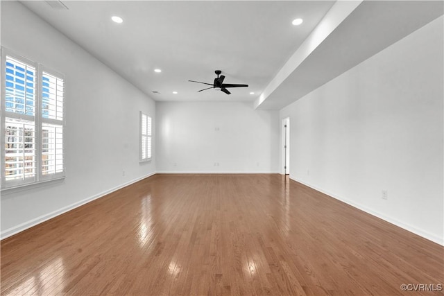 unfurnished room with ceiling fan and hardwood / wood-style flooring