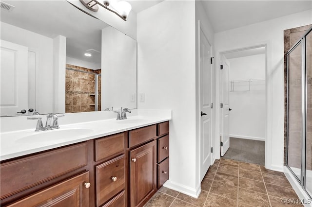 bathroom with walk in shower and vanity