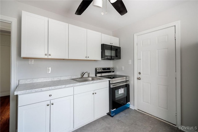 kitchen with ceiling fan, stainless steel electric range, sink, and white cabinetry