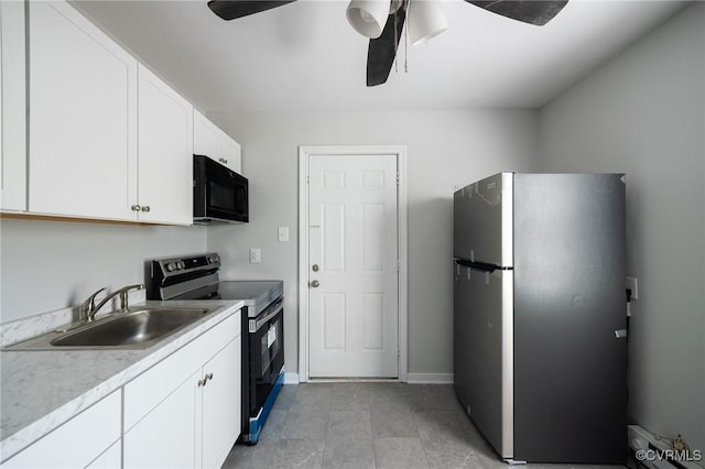 kitchen featuring ceiling fan, white cabinets, sink, and stainless steel appliances