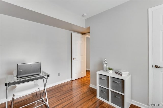 office space with wood-type flooring