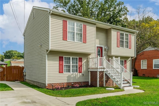 split foyer home with a front lawn