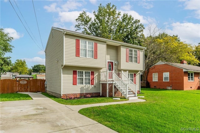 bi-level home with a front lawn