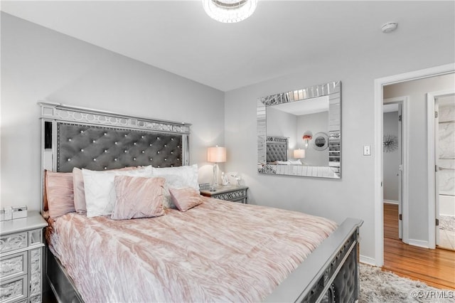 bedroom featuring hardwood / wood-style floors