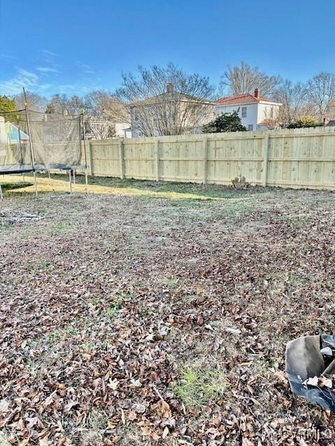 view of yard with a trampoline