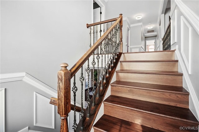 stairs featuring ornamental molding