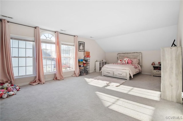 carpeted bedroom featuring lofted ceiling