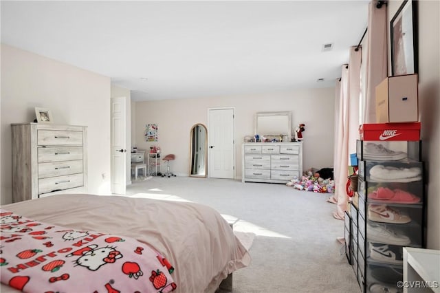 bedroom with light carpet