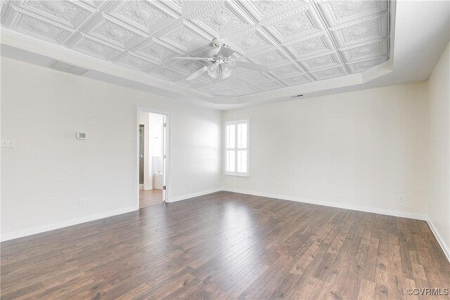 unfurnished room featuring ceiling fan and dark hardwood / wood-style flooring