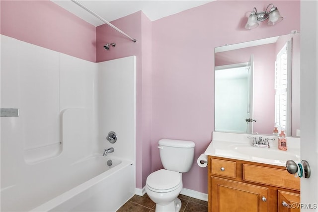 full bathroom with toilet, vanity, tile patterned floors, and shower / washtub combination