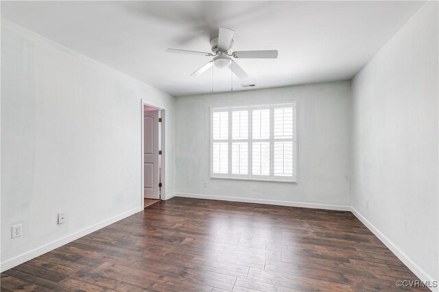 unfurnished room with ceiling fan and dark hardwood / wood-style floors