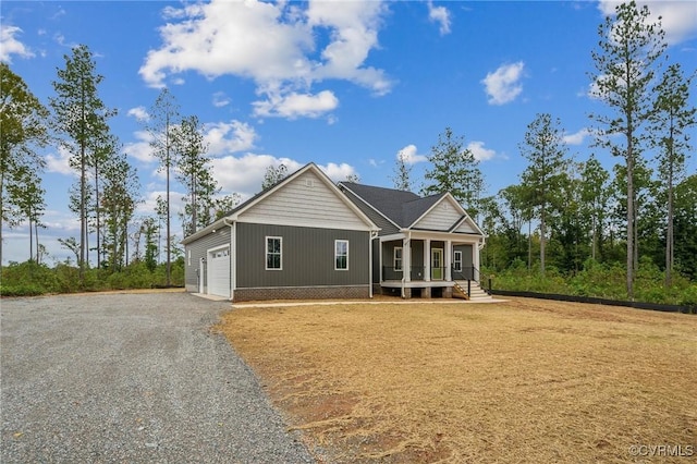 view of front of house featuring covered porch and a garage