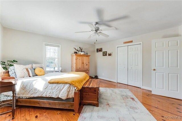 bedroom featuring a closet, ceiling fan, and light hardwood / wood-style floors