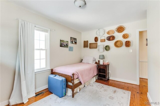 bedroom featuring hardwood / wood-style floors