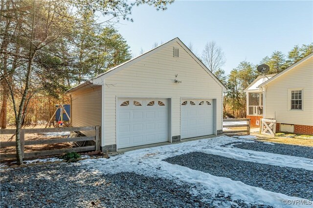 view of snow covered garage