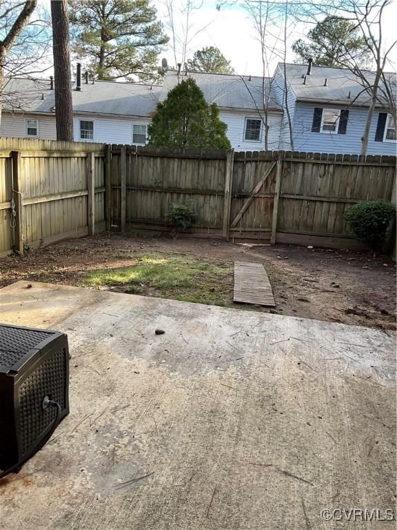 view of yard featuring a patio area and a fenced backyard