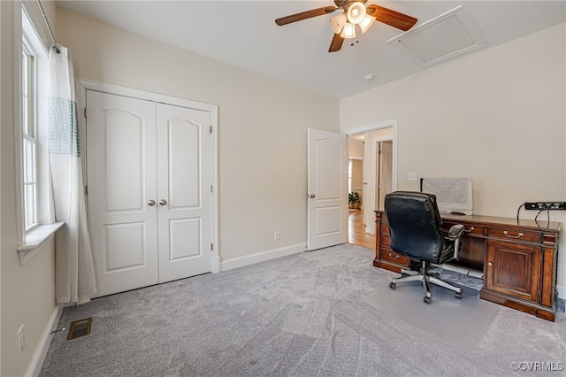 office with ceiling fan and light carpet