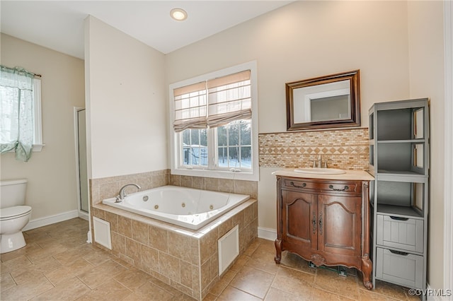 full bathroom featuring plus walk in shower, a wealth of natural light, vanity, and toilet