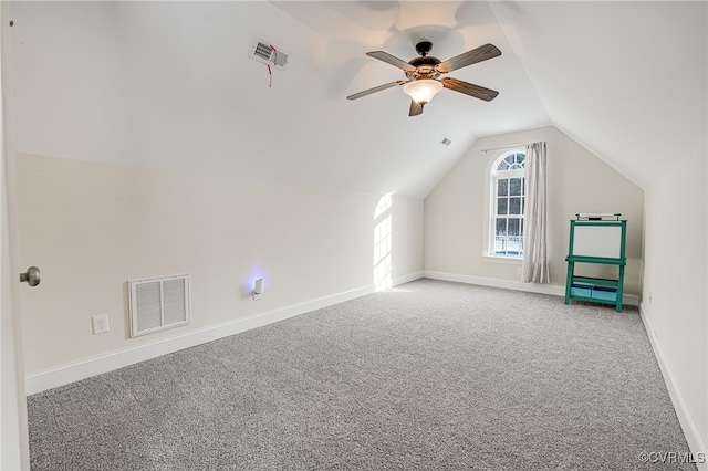 additional living space with lofted ceiling, ceiling fan, and carpet flooring