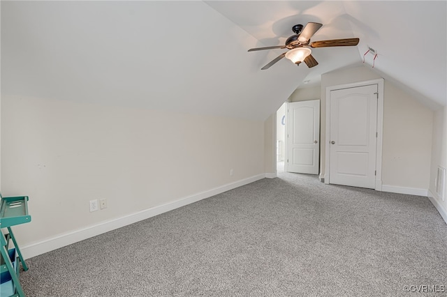 additional living space featuring lofted ceiling, carpet floors, and ceiling fan