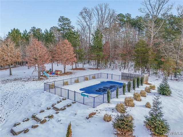 snow covered pool with a playground