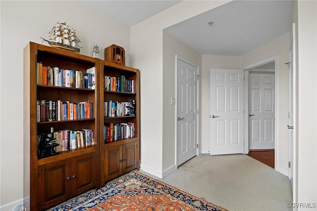 corridor with light colored carpet