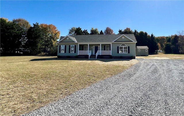 single story home featuring a porch and a front lawn