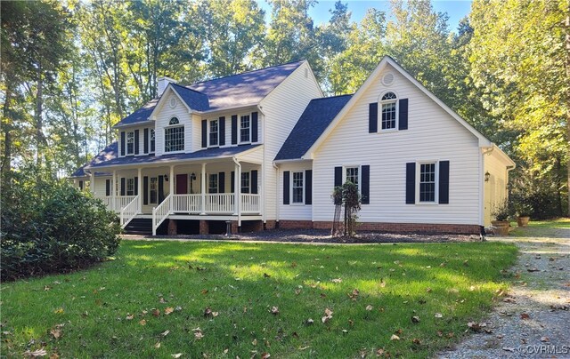 view of front facade with covered porch and a front yard