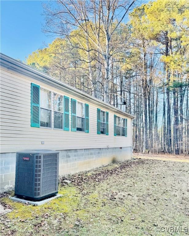 271 Walnut Hill Rd, Crewe, VA 23930 - view of side of home featuring central AC