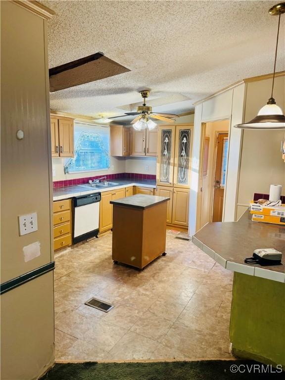 271 Walnut Hill Rd, Crewe, VA 23930 - kitchen featuring white dishwasher, ceiling fan, light brown cabinetry, a kitchen island, and decorative light fixtures