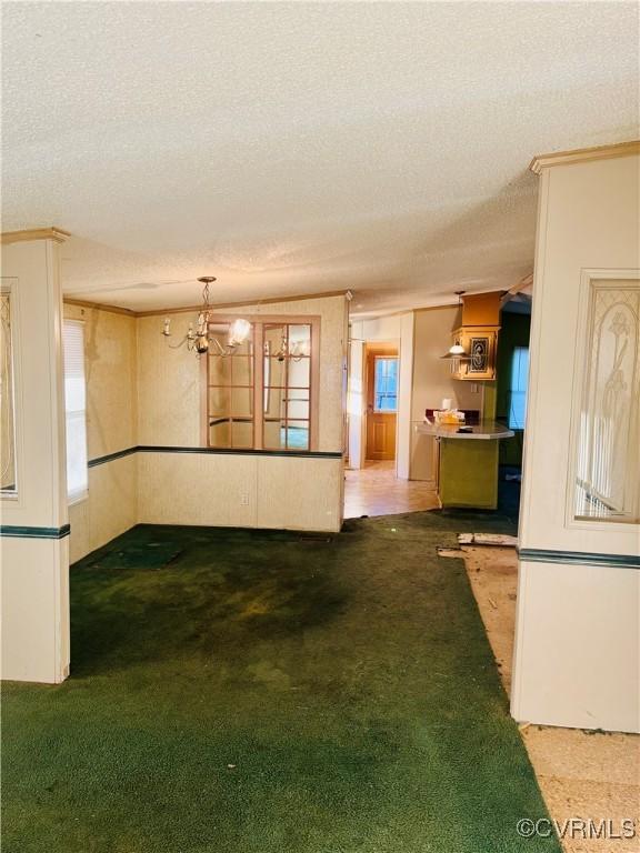 271 Walnut Hill Rd, Crewe, VA 23930 - interior space featuring a textured ceiling, light carpet, and a notable chandelier