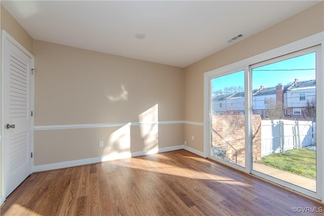 unfurnished room with light hardwood / wood-style flooring