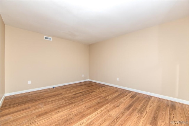 unfurnished room featuring light hardwood / wood-style flooring