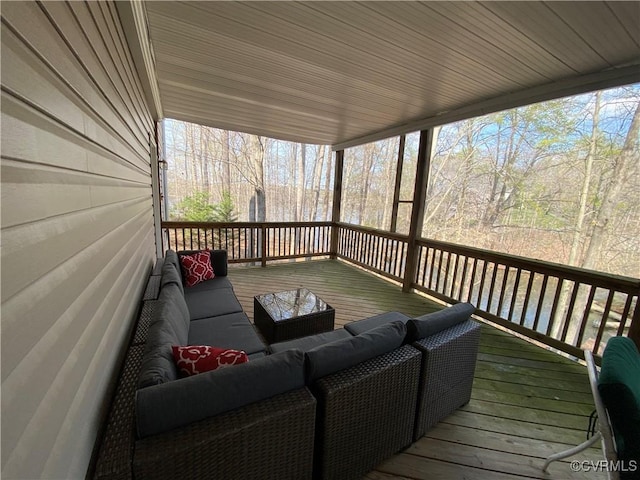 wooden deck featuring an outdoor hangout area