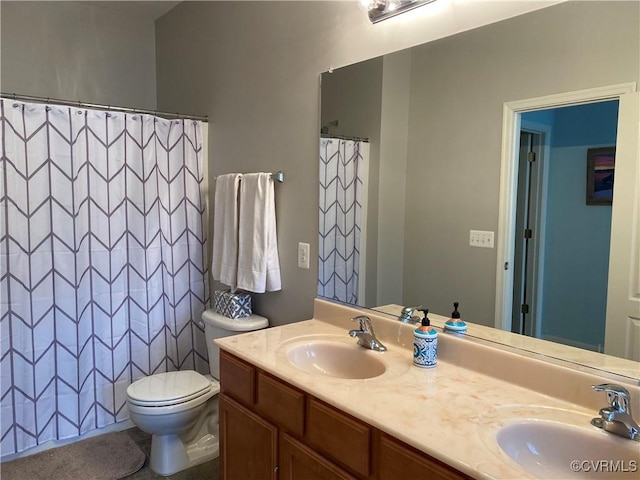 bathroom featuring toilet, walk in shower, and vanity