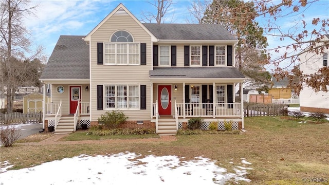 view of front of property featuring a front lawn and a porch