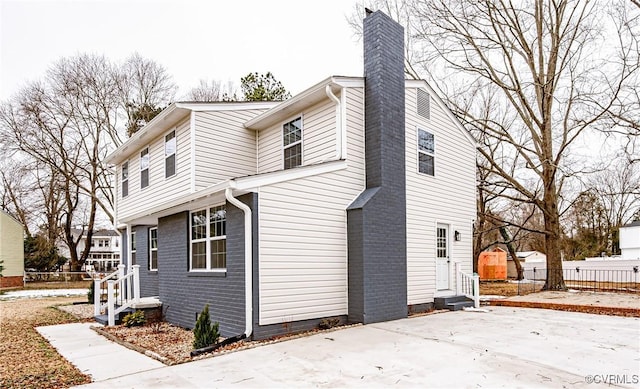 view of side of home featuring a patio area