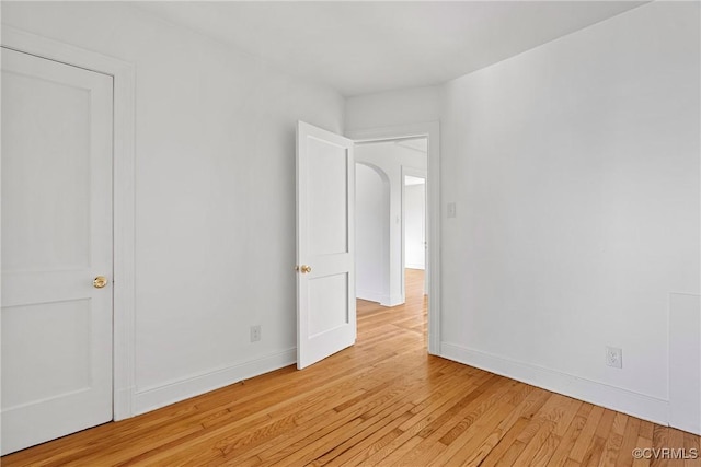 empty room with light hardwood / wood-style flooring