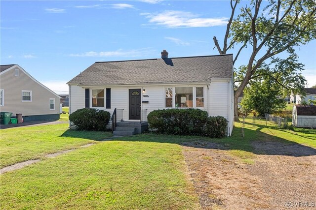 bungalow with a front yard