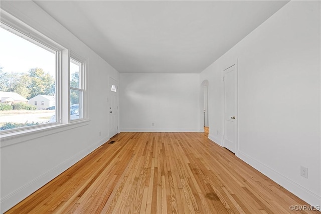 unfurnished room featuring light wood-type flooring