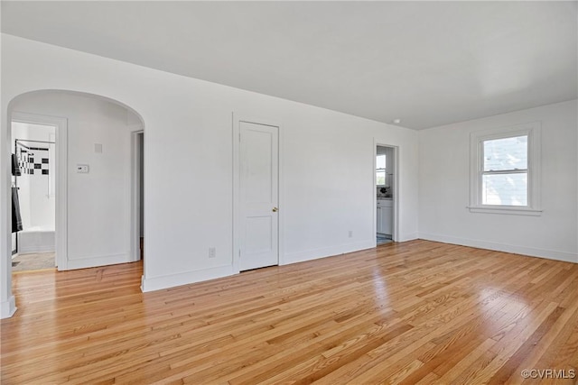 spare room featuring light hardwood / wood-style floors