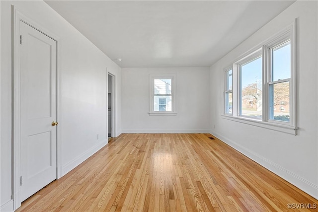 spare room with light wood-type flooring