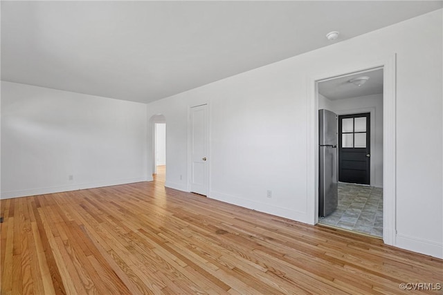 unfurnished room featuring light hardwood / wood-style floors