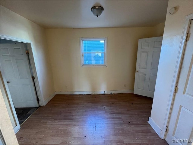 unfurnished bedroom featuring wood-type flooring