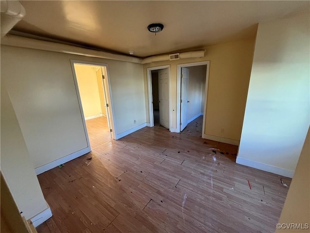 unfurnished bedroom with light hardwood / wood-style floors