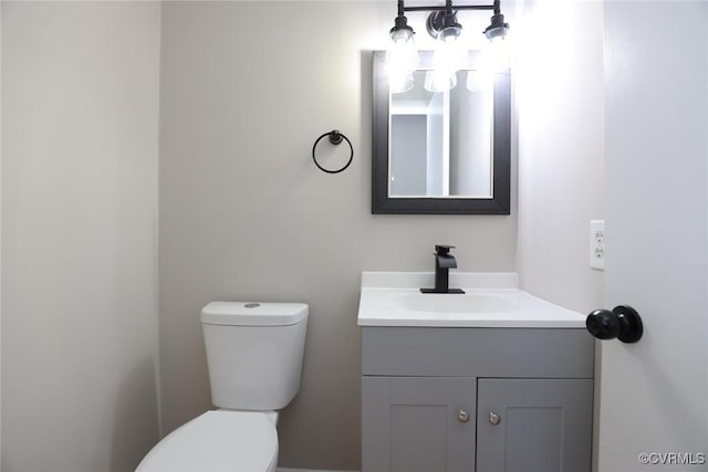 bathroom with toilet and vanity